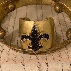 Fleur De Lis ladies cuff with black crystals.